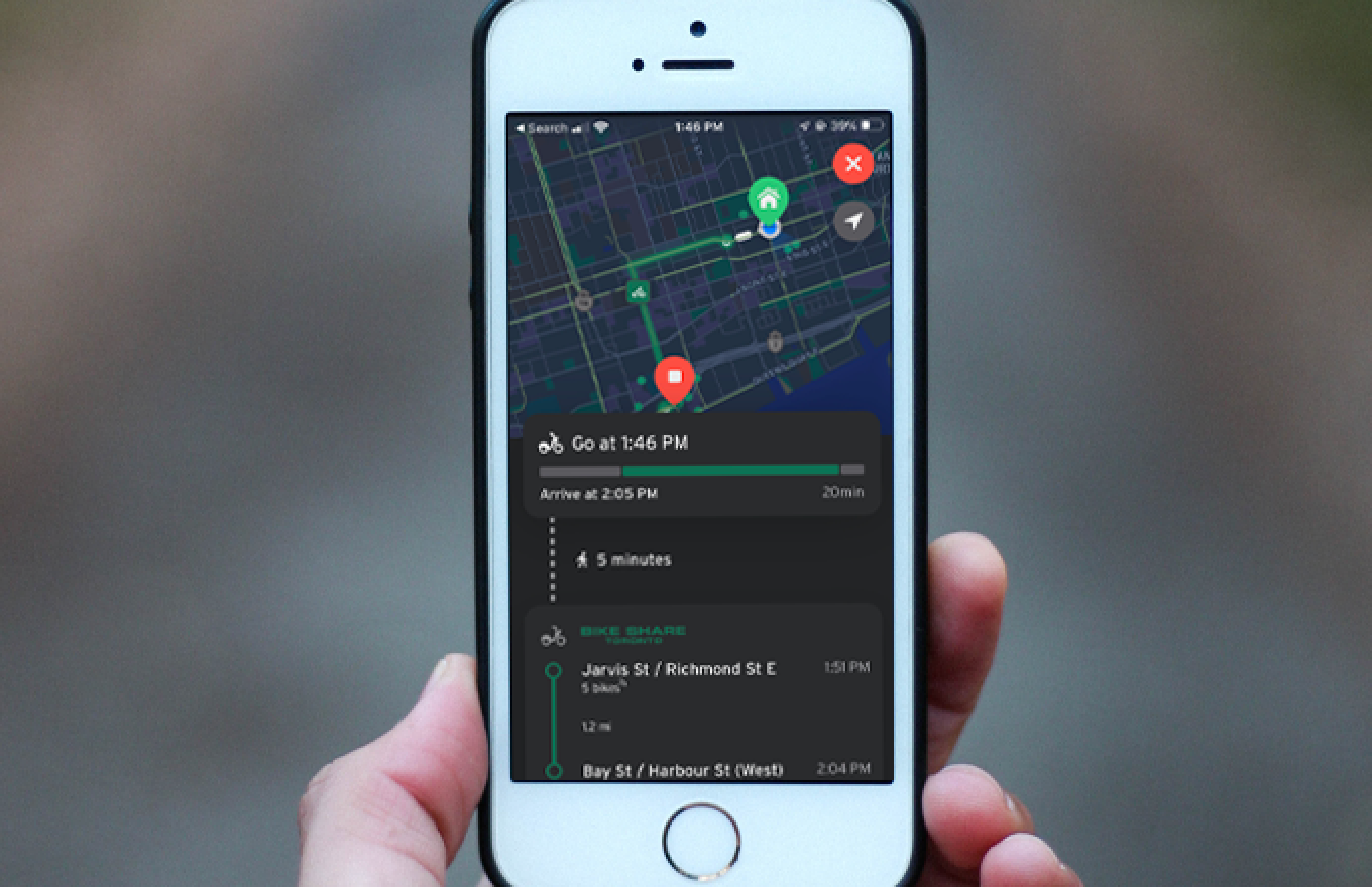 hand holding a phone displaying bike share route
