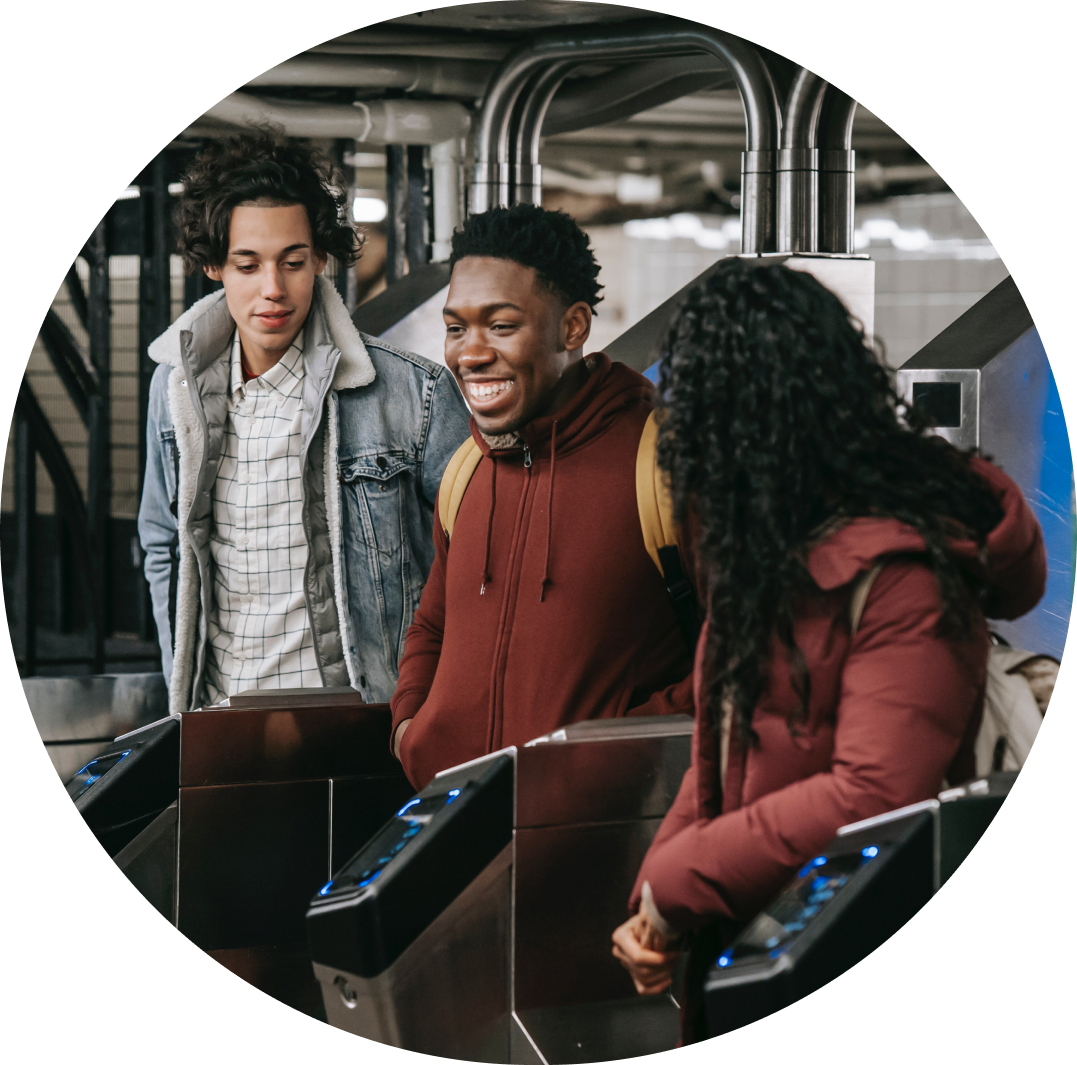 three people side by side in a subway station