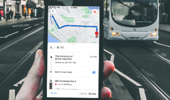 hand holding a phone that displays trip planner